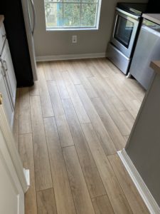 LVP covering outdated tile floors at condo